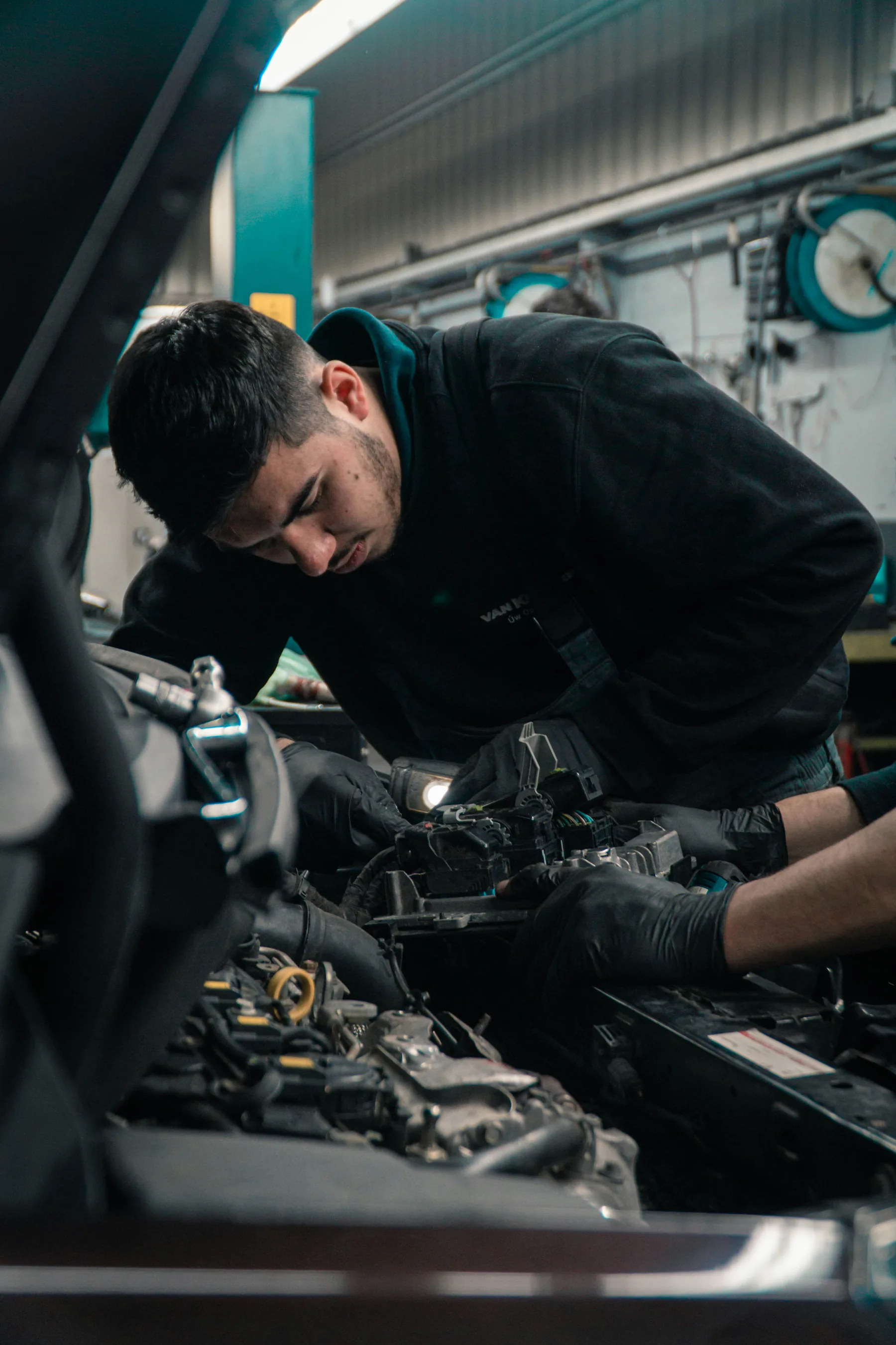 Mechanic carrying out detailed workshop inspection