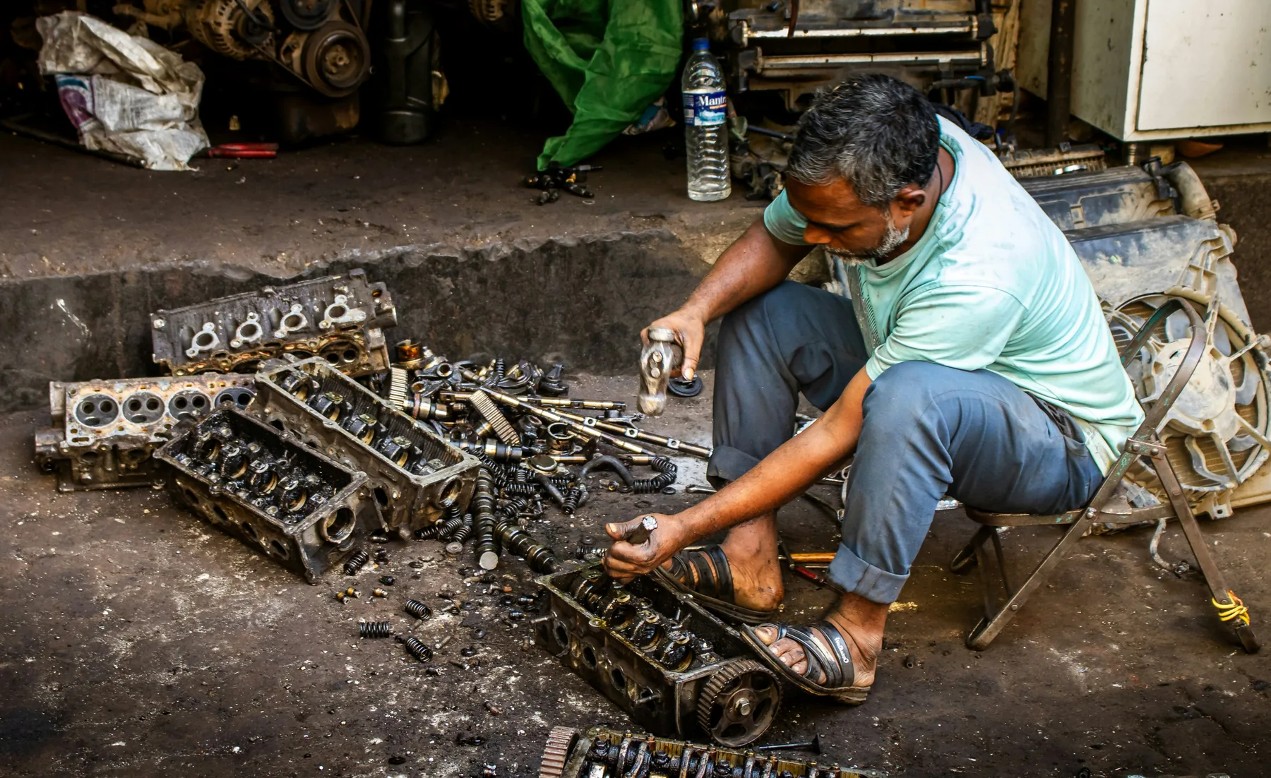 Vehicle components being carefully dismantled